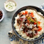 This Greek Mashed Potato Bowl is made with lamb, kalamata olives, sautéed onions, fresh diced tomatoes and, of course, Idahoan mashed potatoes!
