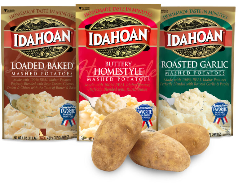 Pouches of Idahoan Mashed Potatoes with raw potatoes